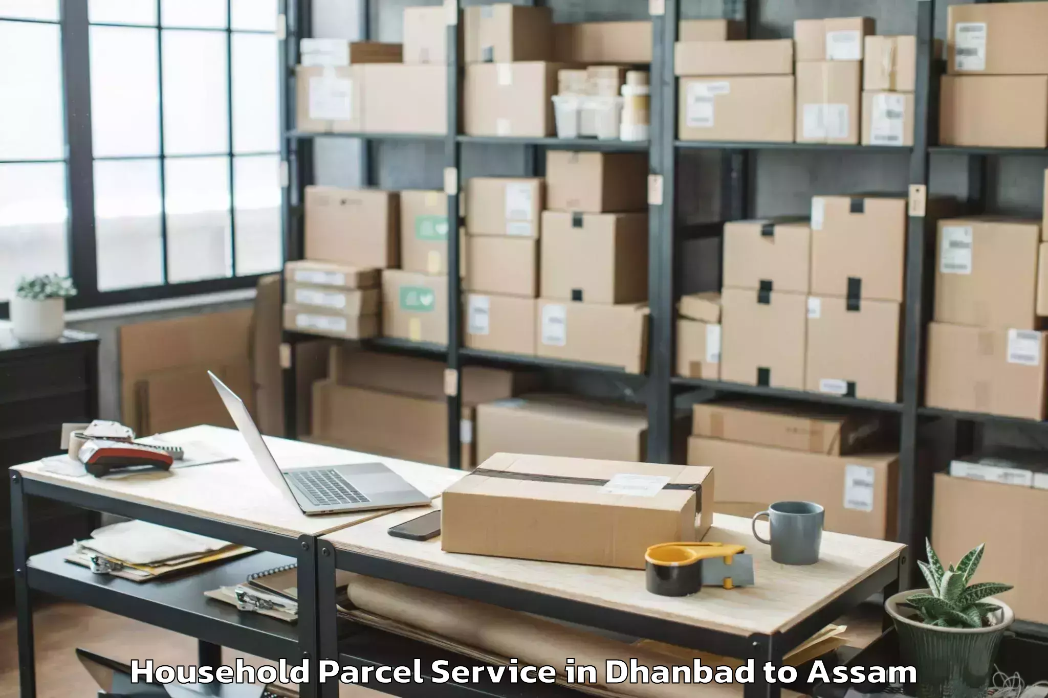 Quality Dhanbad to Pachim Nalbari Household Parcel